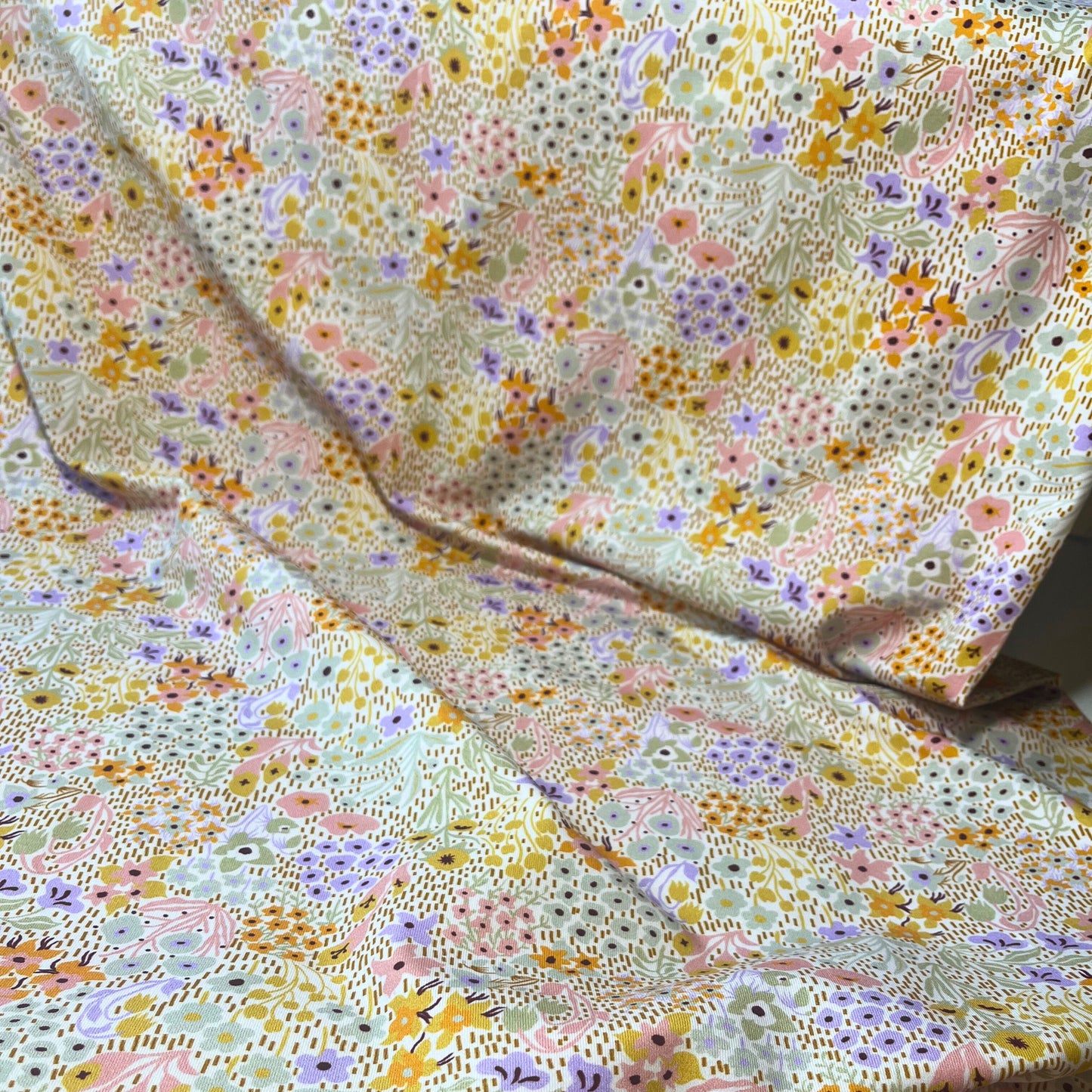 Gentle spring floral jersey fabric with 4-way stretch – great for sewing for toddlers and young children.