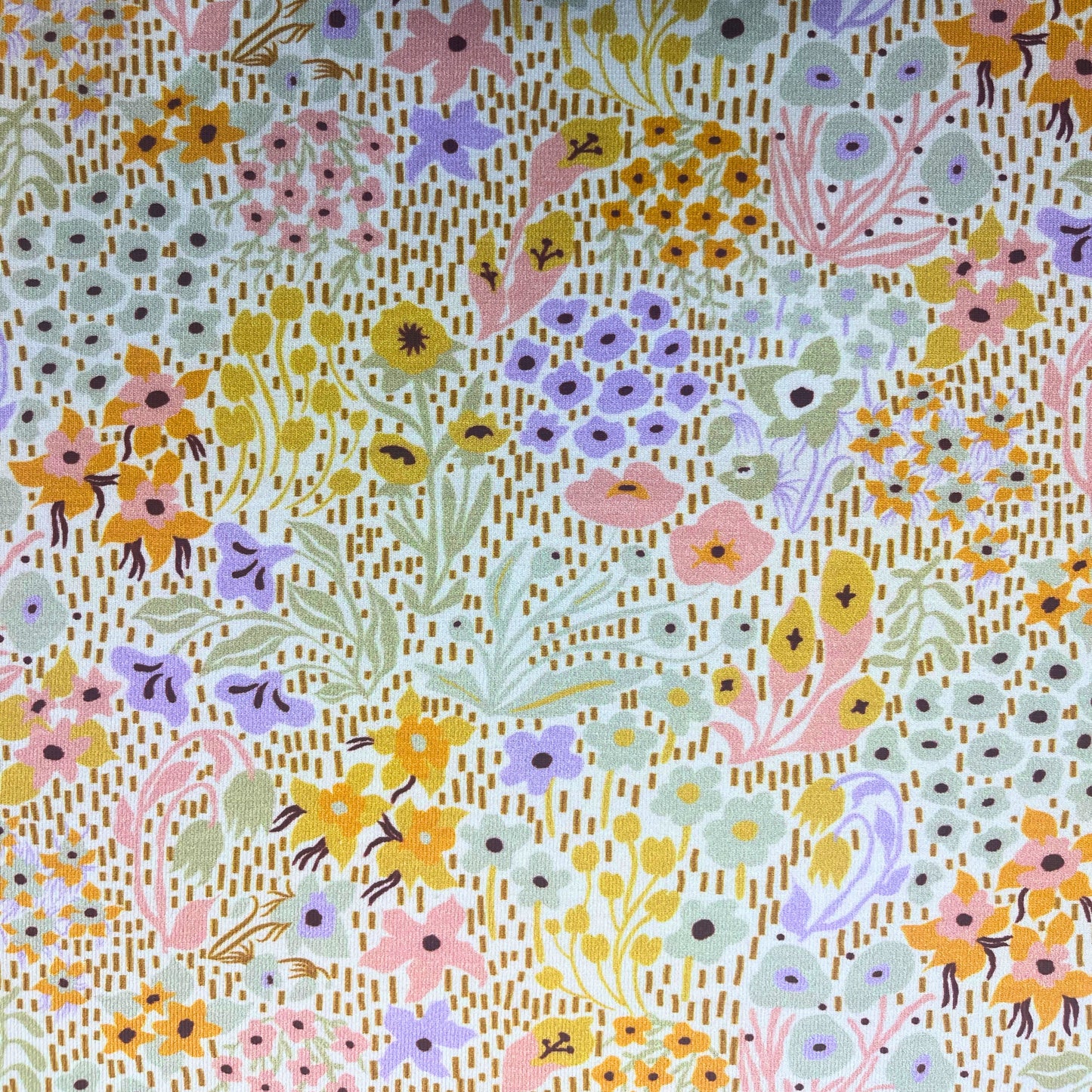 Gentle spring floral jersey fabric with 4-way stretch – great for sewing for toddlers and young children.
