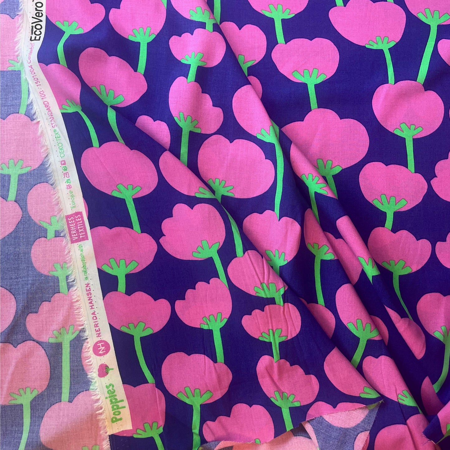Draped Trail Run fabric highlighting the fluid movement and vibrant colour palette, perfect for confident, creative sewing.