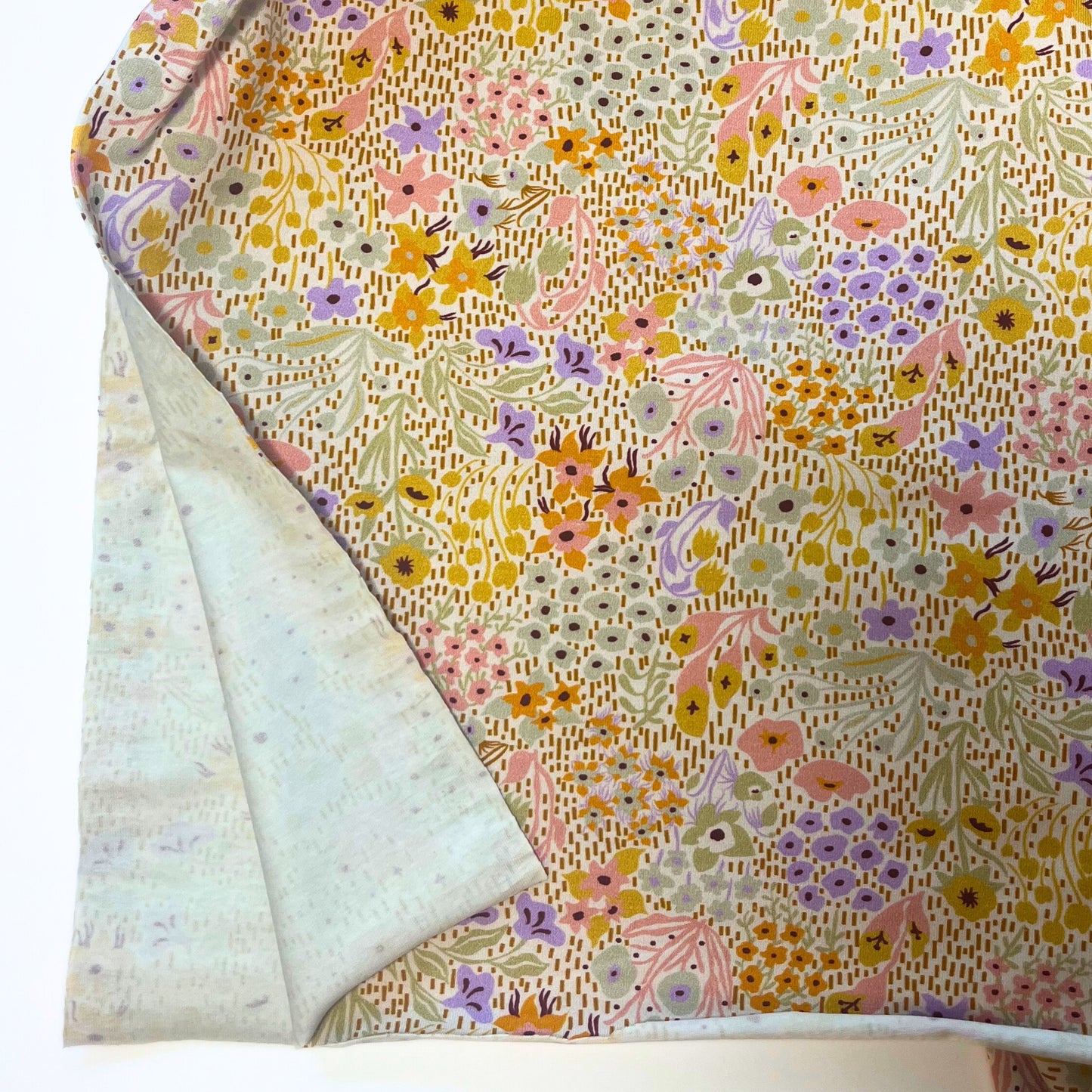 Light and breathable cotton jersey fabric with delicate wildflower print, suitable for babywear and comfy handmade loungewear.