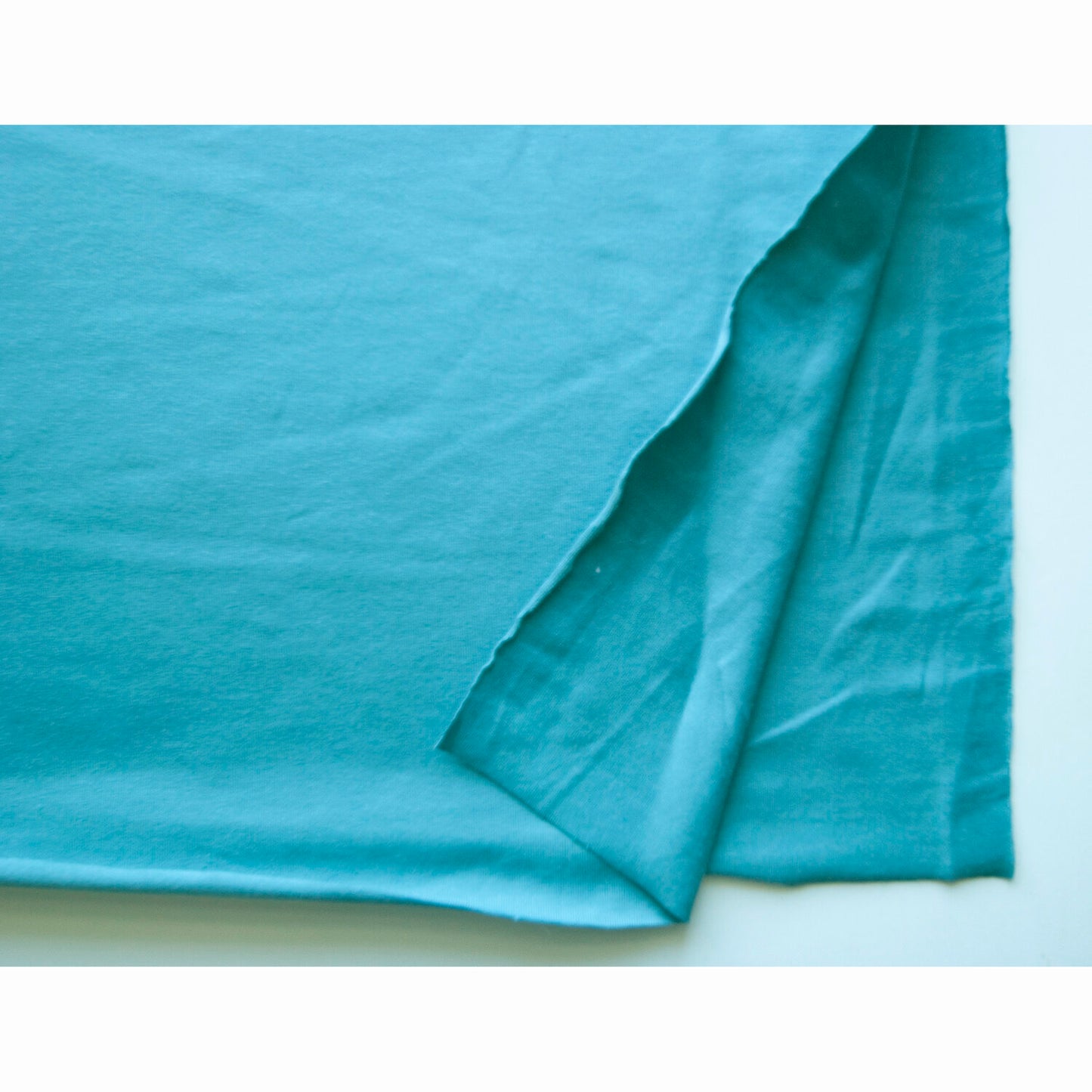 Teal Single Stretch Cotton Jersey. Sold in half meters, Oeko-Tex Standard 100.