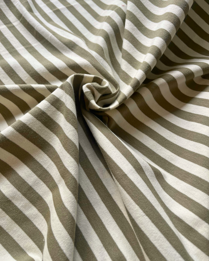 Moss green and warm white striped French terry fabric folded to reveal soft brushed reverse — Oeko-Tex Class 1 certified, perfect for handmade loungewear and children's clothing