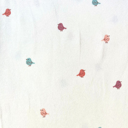 Miniature birds stretch jersey fabric in white with scattered small bird print in soft muted rose, putty and teal, 150cm wide — 200gsm 95% cotton 5% elastane knit for handmade baby and children's clothing
