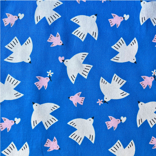 Daisy Bird digital cotton jersey fabric in bright blue with white and pink bird print, 150cm wide — soft 100% cotton knit for handmade t-shirts, dresses, leggings and children's clothing