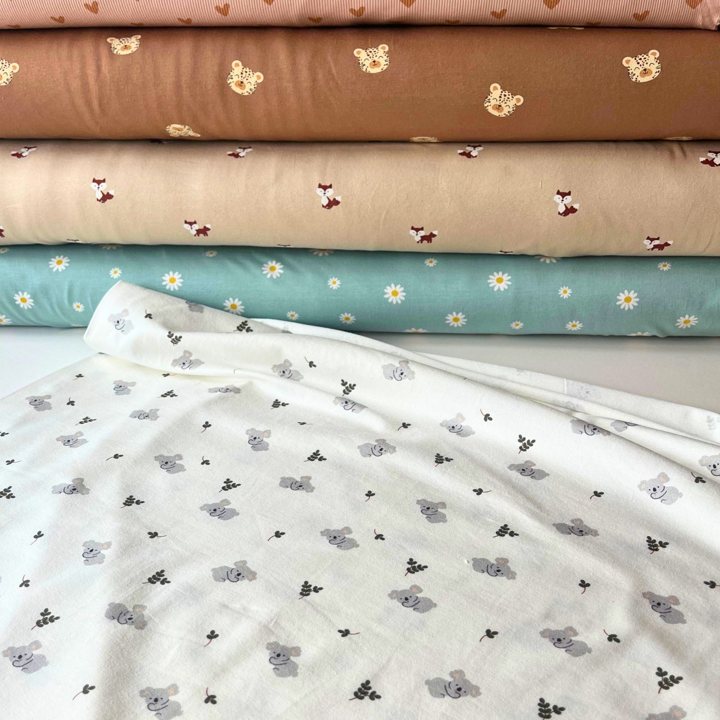 95% cotton 5% elastane stretch fabric for handmade baby clothes.