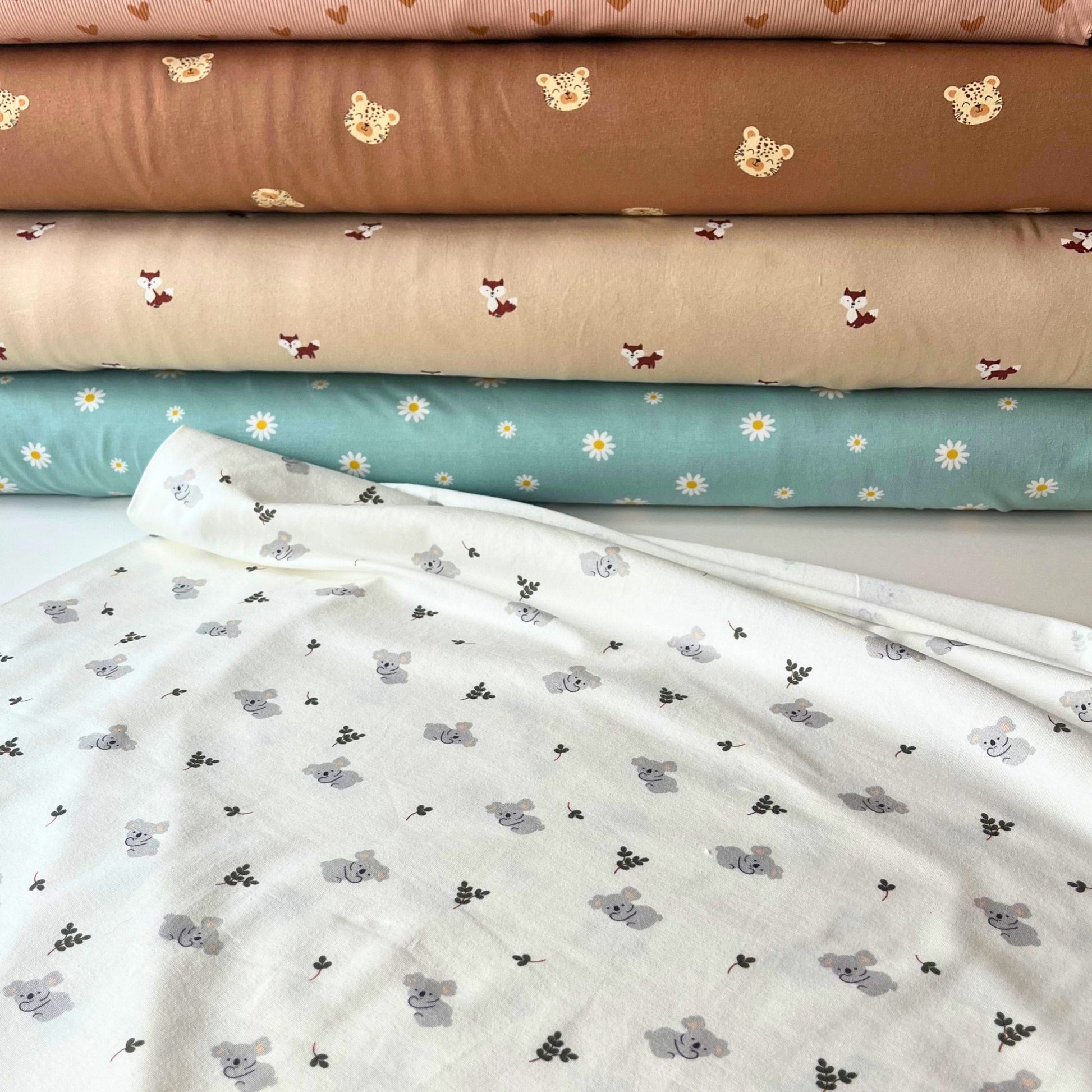 95% cotton 5% elastane stretch fabric for handmade baby clothes.