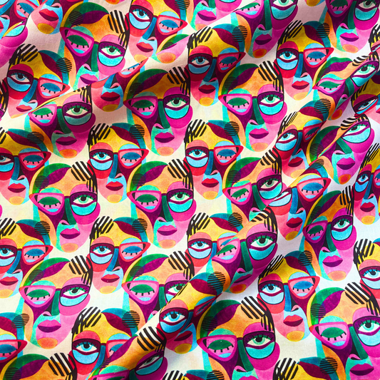 Little Johnny abstract painted faces cotton fabric in multicolour rainbow palette on white base with bold black linework, 149cm wide — 115gsm 100% cotton woven for handmade statement dresses, blouses and oversized shirts