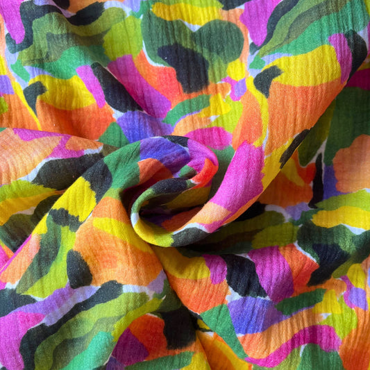 Tropical Palette double gauze fabric in white with expressive paint streak print in jungle greens, purples and warm oranges and yellows, 130cm wide — lightweight 125gsm 100% cotton woven for handmade summer dresses and children's clothing