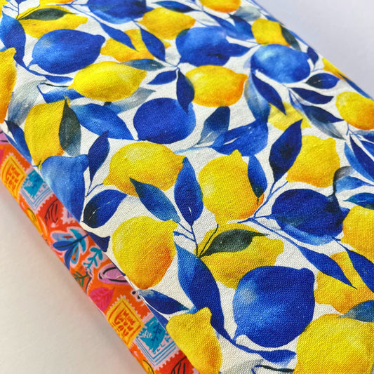 Lemon print linen mix fabric in white with large bold yellow and green lemon print, 150cm wide — 55% linen 45% viscose woven fabric for handmade summer dresses, blouses and wide-leg trousers