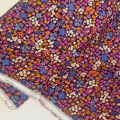 Bloomkind Meadow Dusk premium rayon fabric by Art Gallery Fabrics, featuring a romantic botanical print with meadow florals in dusky pink, plum, orange, and navy on a fluid viscose base