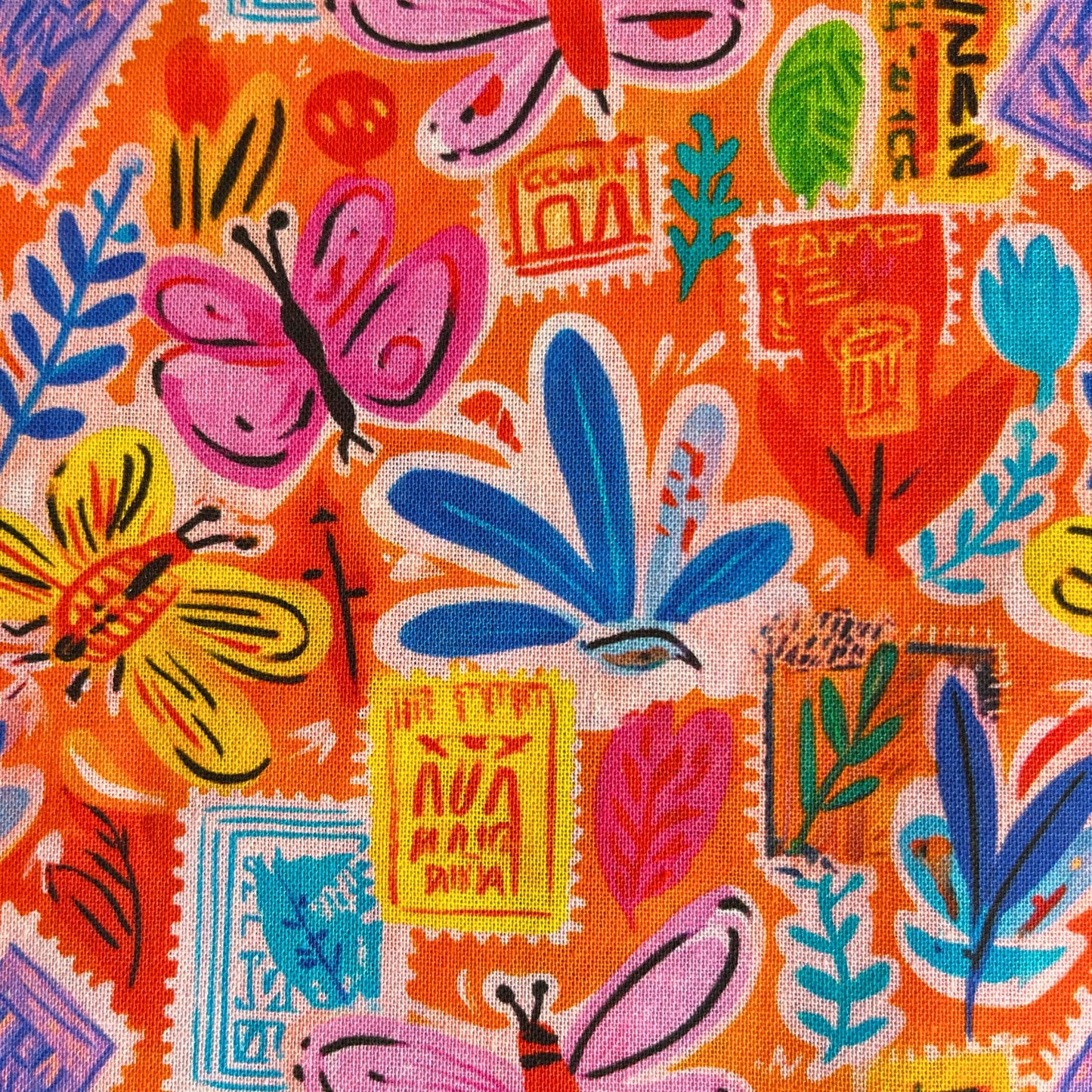 Postcard Garden cotton fabric in vibrant orange with small scattered postcard motifs, botanical prints and butterflies, 150cm wide — 100% cotton woven from Empee Studio for handmade dresses, blouses and children's clothing