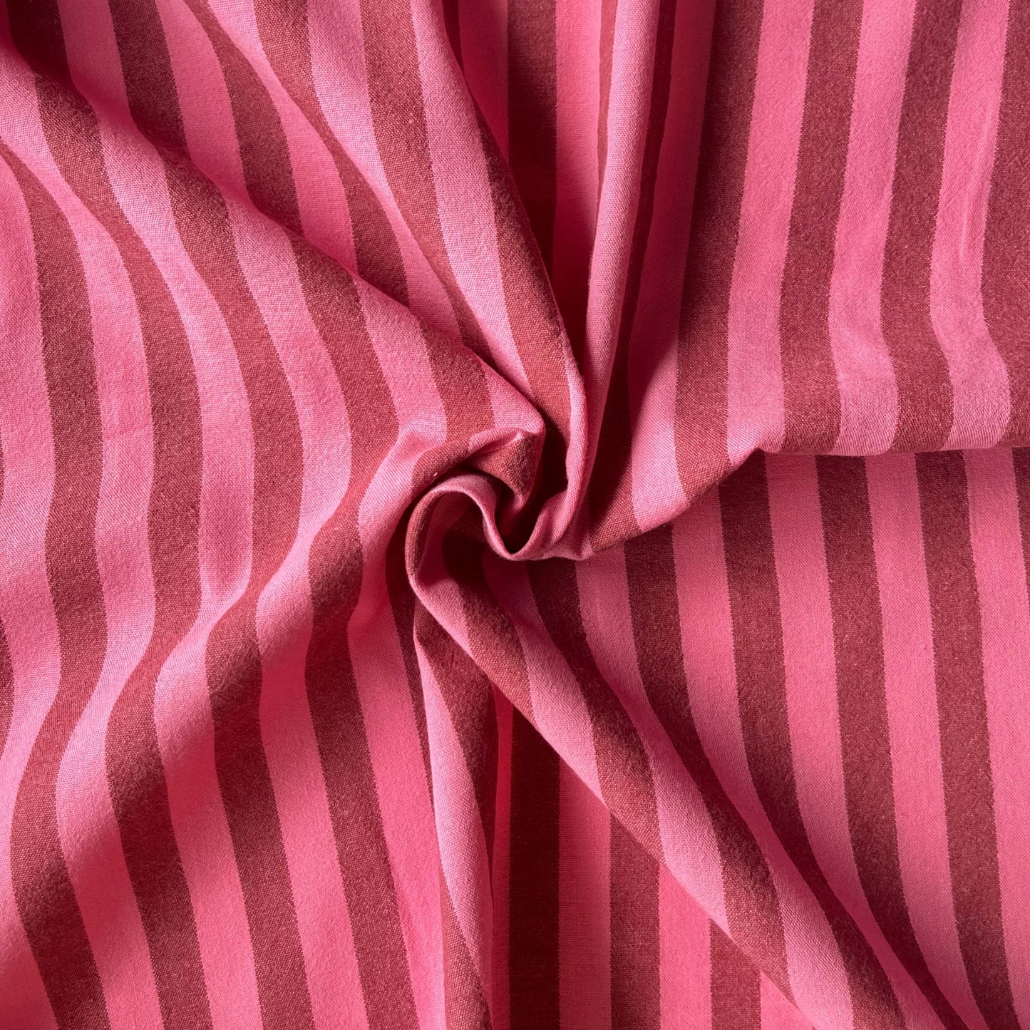 Cotton yarn dyed stripe fabric in washed pink and faded red, 1.25cm stripe, 145cm wide — lightweight 115gsm 100% cotton woven fabric with a beautiful laundered quality for handmade dresses and blouses