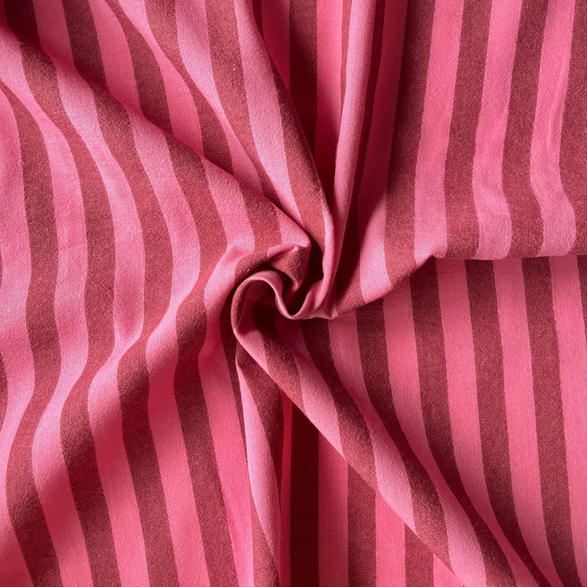 Cotton yarn dyed stripe fabric in washed pink and faded red, 1.25cm stripe, 145cm wide — lightweight 115gsm 100% cotton woven fabric with a beautiful laundered quality for handmade dresses and blouses