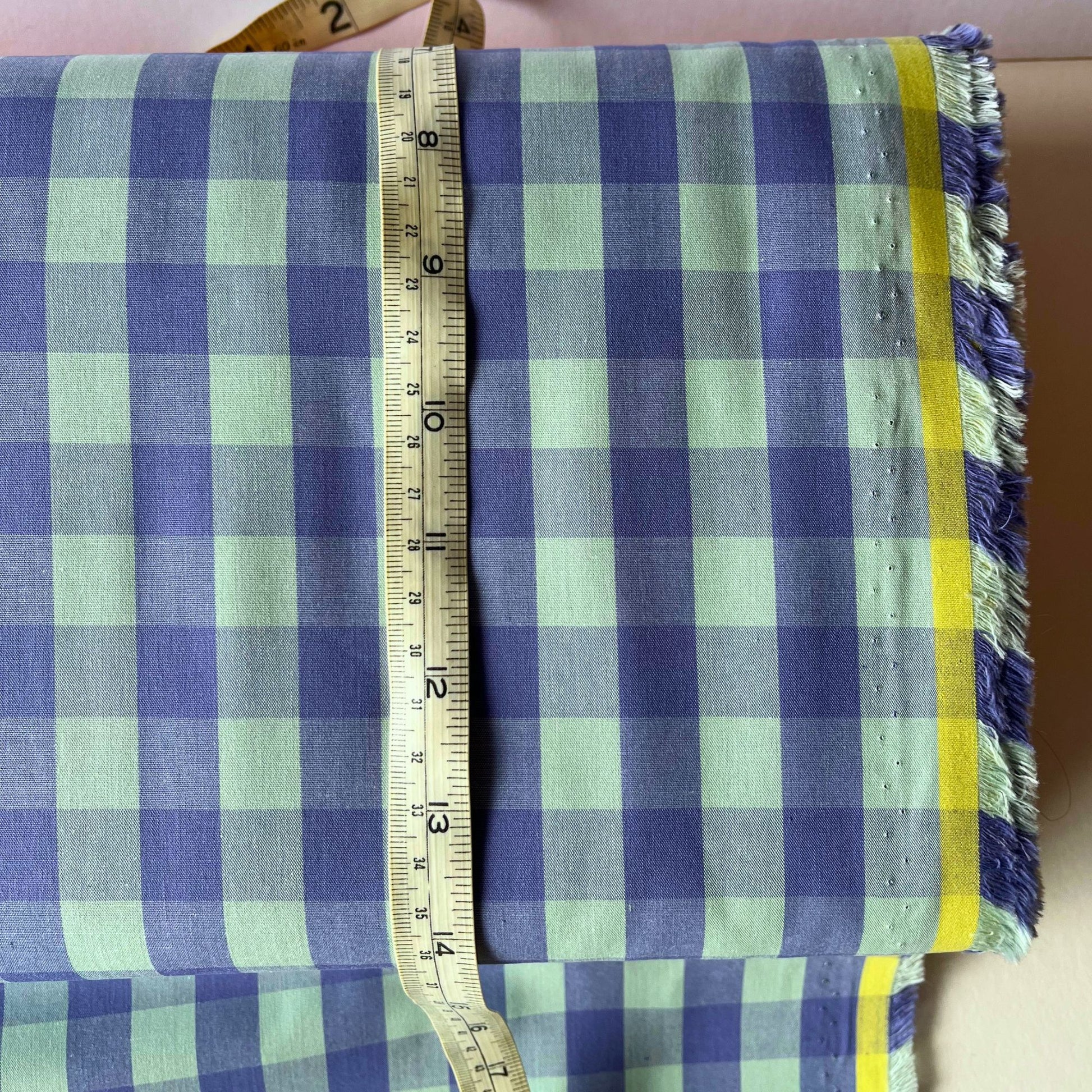 Close-up of lavender and mint yarn dyed gingham check cotton fabric showing crisp 1.75cm check definition and soft woven texture — Oeko-Tex Standard 100 certified, ideal for dressmaking