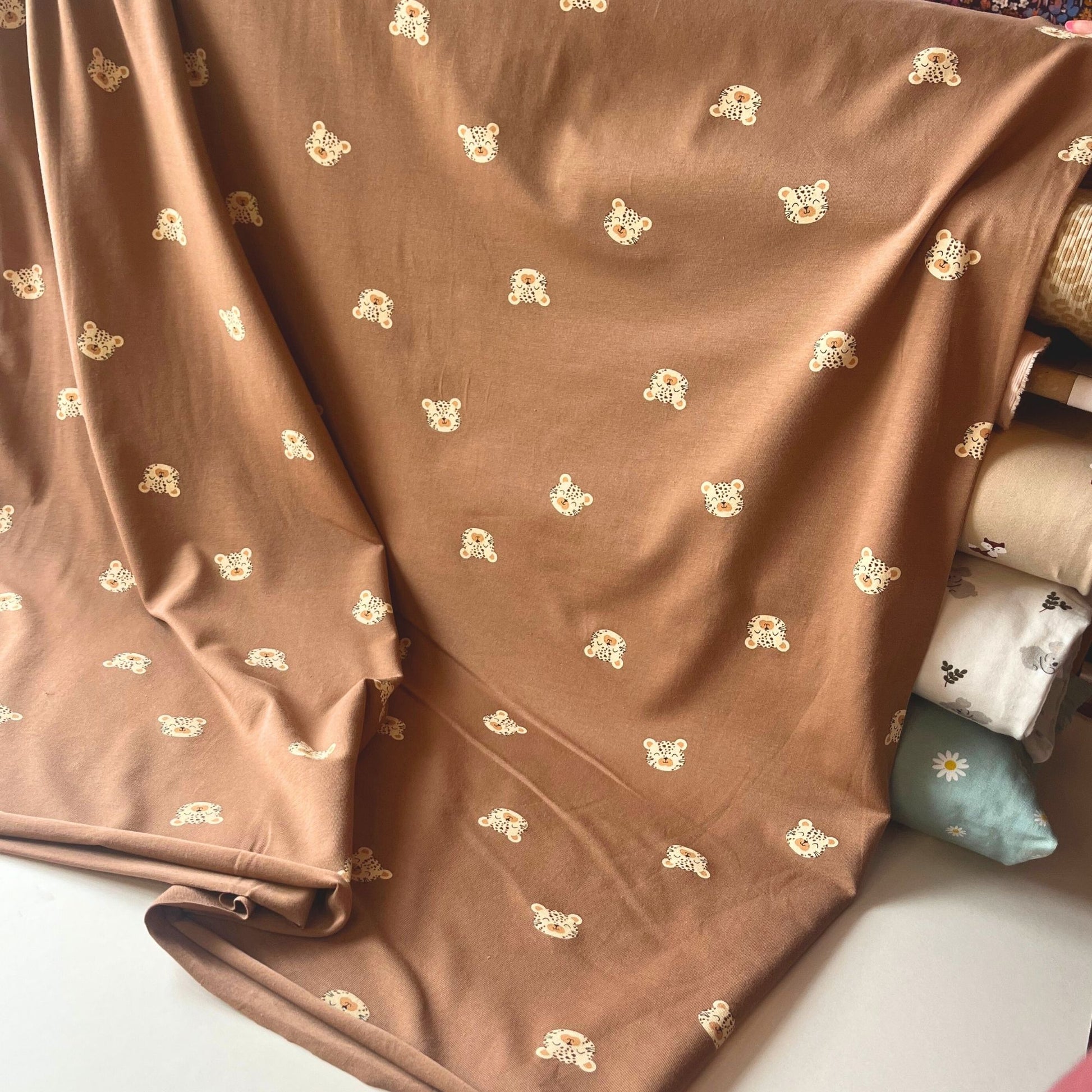 Child-friendly animal print jersey fabric ideal for everyday kidswear.