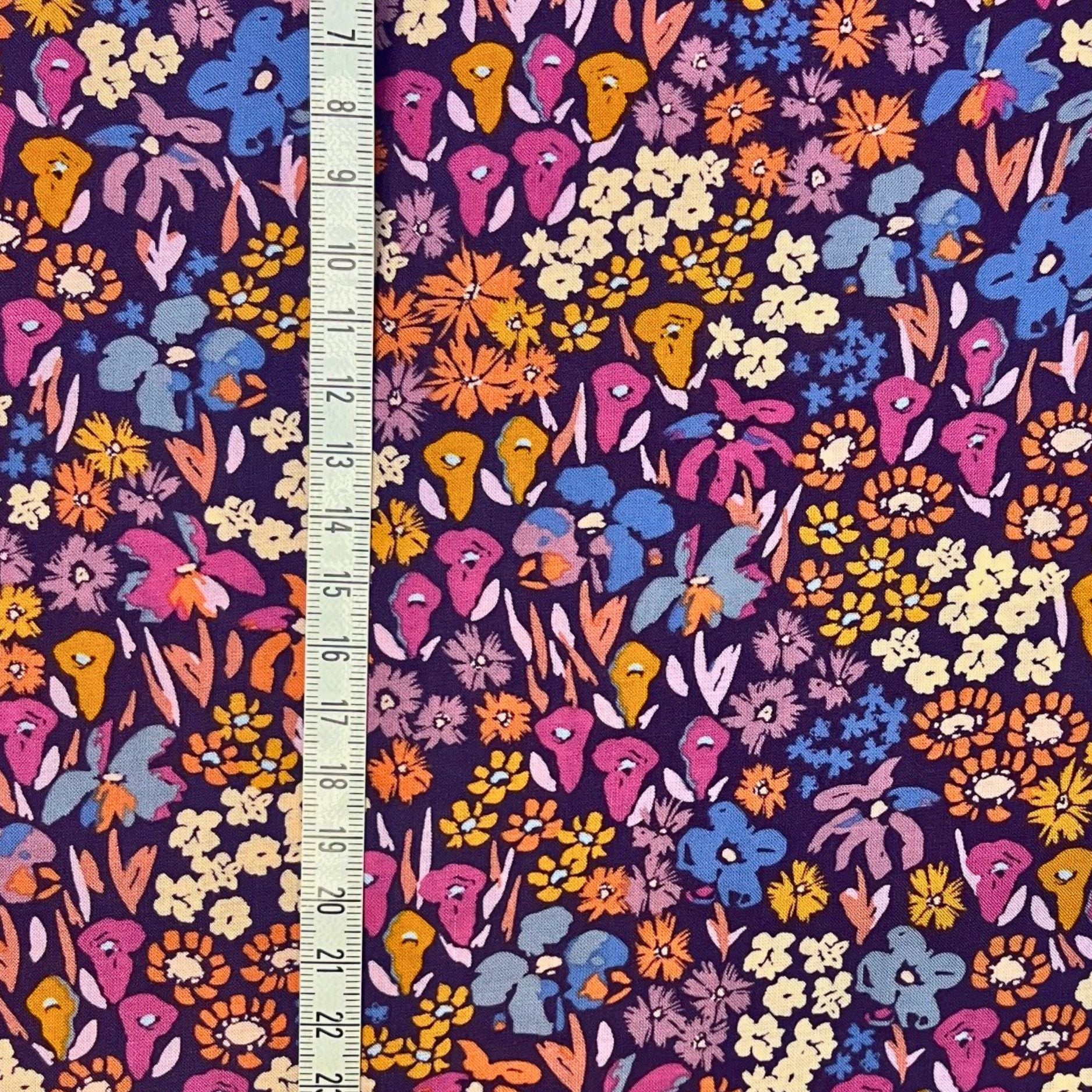 Art Gallery Fabrics premium rayon in Bloomkind Meadow Dusk — a painterly floral print in dusk-inspired hues of plum, orange, pink, and navy, 54 inches wide