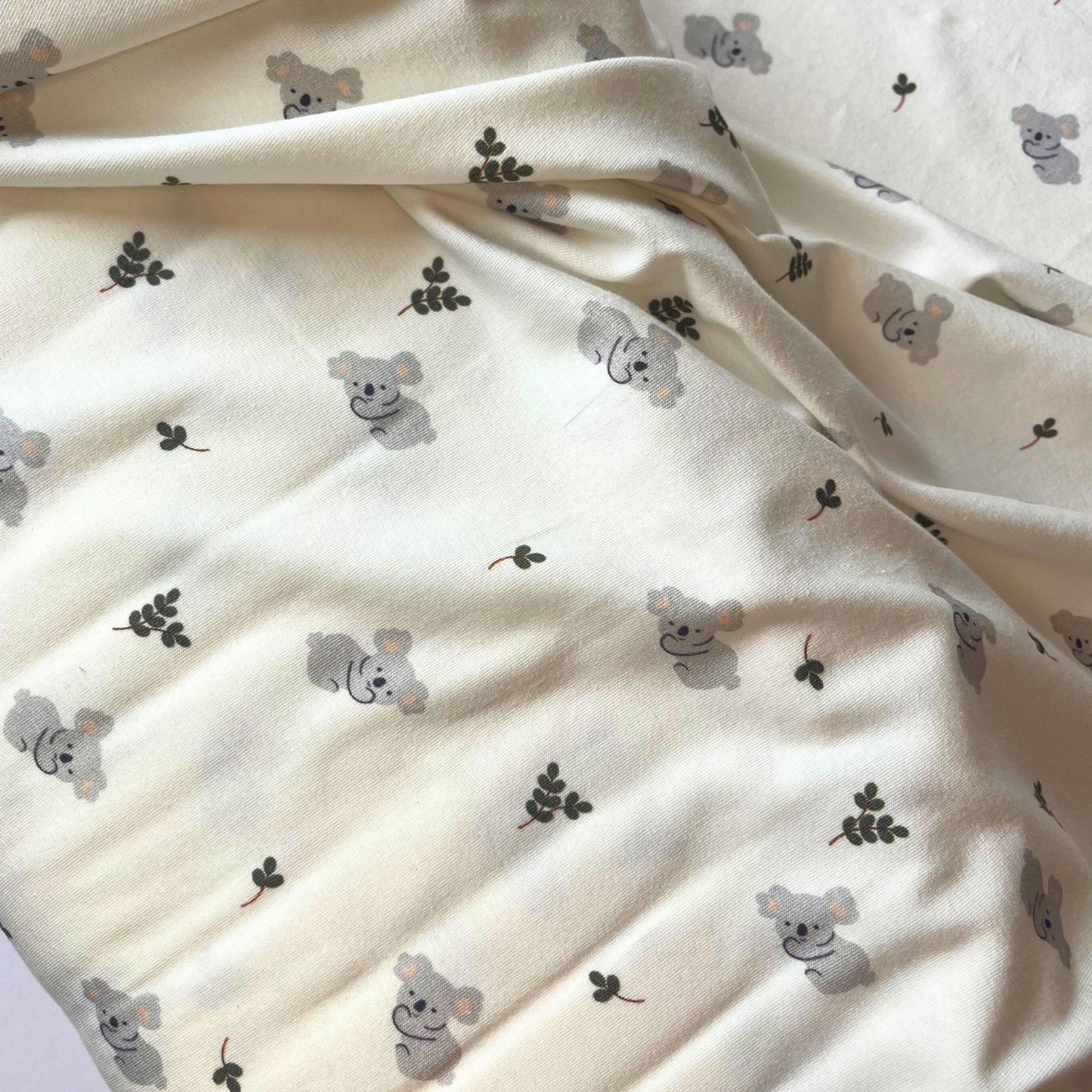 Close-up of adorable koala print jersey for sensitive skin