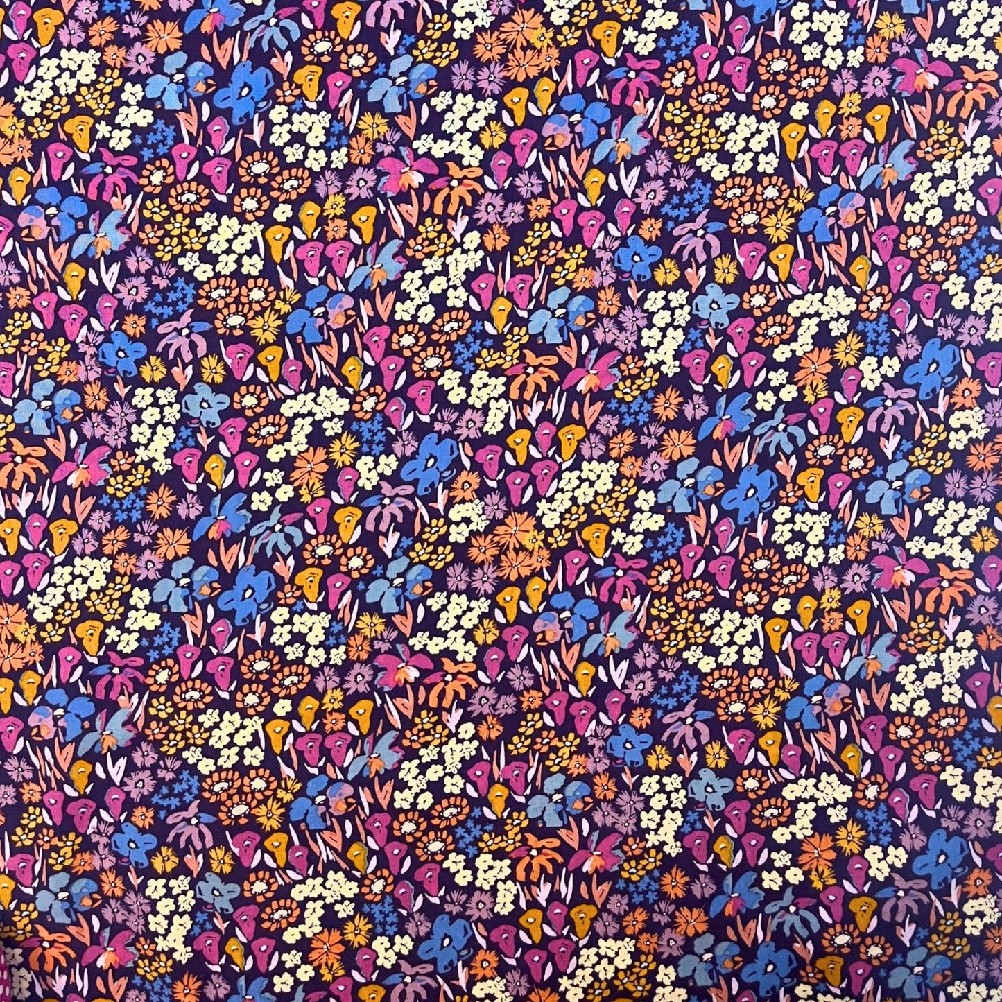 Dusk Fusion collection rayon fabric by AGF Studio with layered meadow floral print in warm sunset and deep twilight tones, ideal for dressmaking