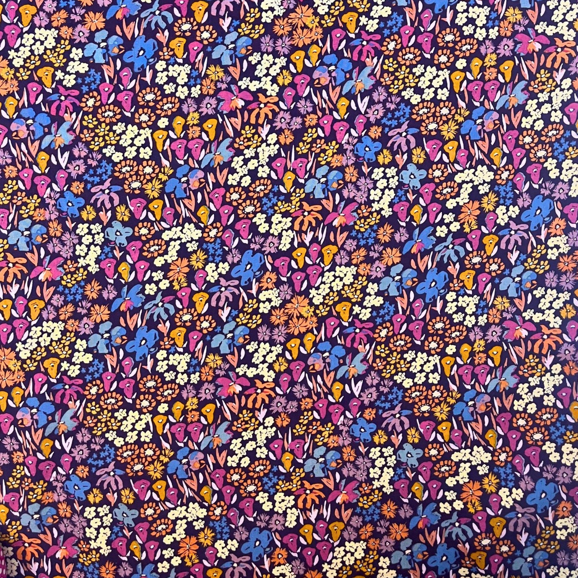 Dusk Fusion collection rayon fabric by AGF Studio with layered meadow floral print in warm sunset and deep twilight tones, ideal for dressmaking