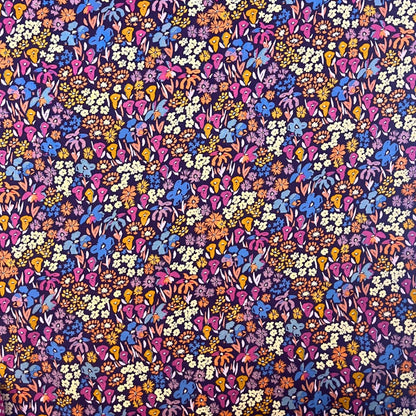 Dusk Fusion collection rayon fabric by AGF Studio with layered meadow floral print in warm sunset and deep twilight tones, ideal for dressmaking