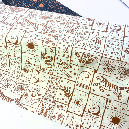 White cotton poplin with irregular caramel and ginger celestial patchwork print featuring tigers, florals, stars and moons — Oeko-Tex Standard 100 certified 100% cotton woven for bold slow fashion dressmaking and statement handmade garments