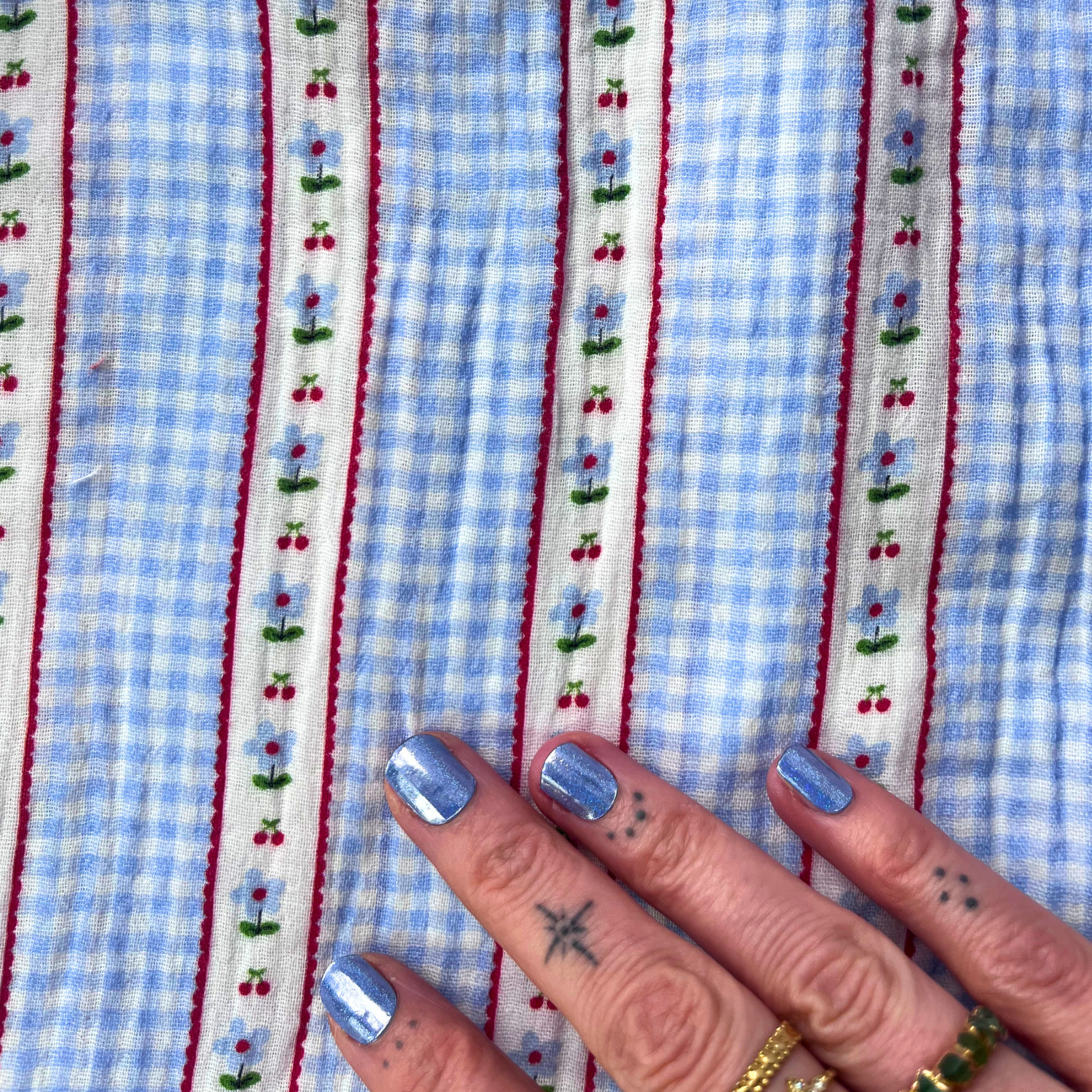 Light blue and white gingham double gauze fabric with delicate vertical ditsy stripe detail — Oeko-Tex Standard 100 certified 100% cotton soft two-layer woven from Poppy Fabrics for slow fashion dressmaking, babywear and children's clothing