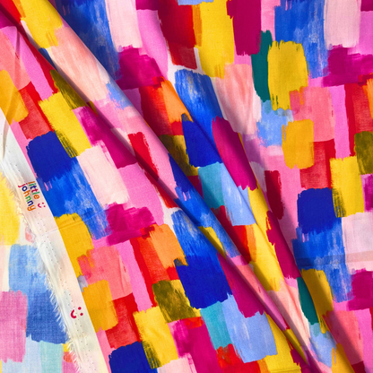 Bold large scale abstract brushstroke print on white viscose rayon fabric in vivid pinks, orange, yellow, blues and greens — digitally printed 100% viscose from Little Johnny with beautiful fluid drape for slow fashion dressmaking and statement handmade garments