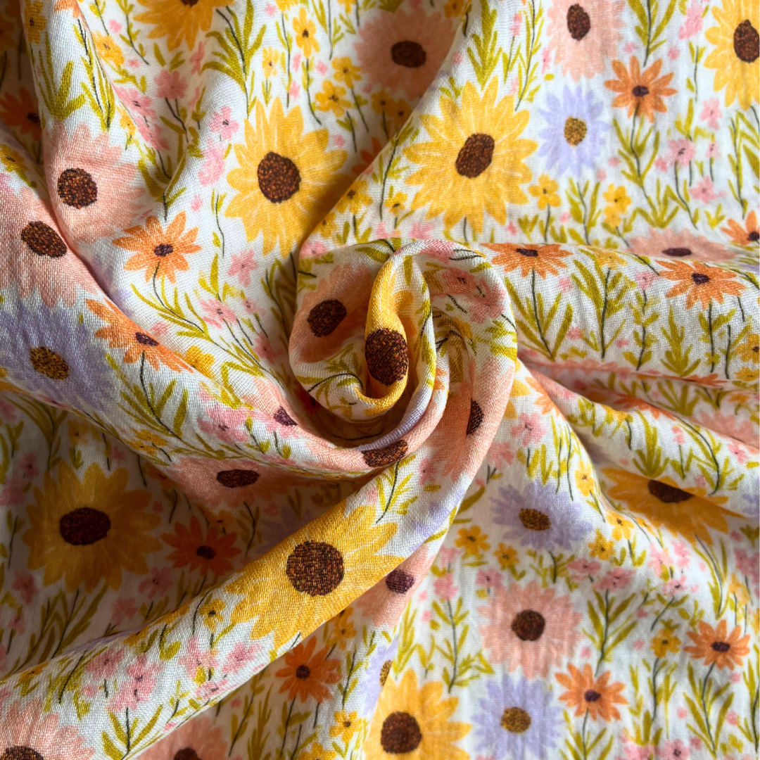 Yellow digital floral double gauze fabric with scattered sunflower print — Oeko-Tex Standard 100 certified soft cotton for slow fashion sewing, children's clothing and baby gifts