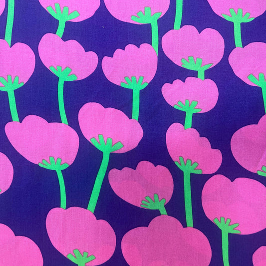 Close-up of Trail Run viscose fabric by Nerida Hansen, showing bold abstract cotton bud print in purple, blue, and green.

