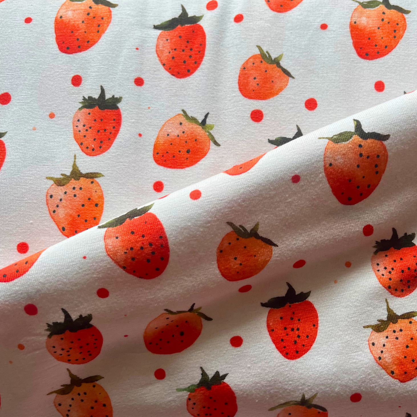 Little Johnny strawberries digital cotton jersey in cream with juicy red scattered strawberry print — Oeko-Tex Standard 100 certified stretch fabric for slow fashion sewing and handmade baby gifts #sewfruity