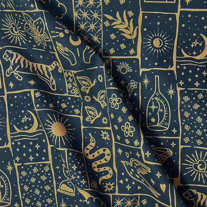 Celestial patchwork print cotton poplin fabric on black base with irregular caramel and ginger patches filled with tigers, florals, stars and moons, 148cm wide — lightweight 110gsm 100% cotton woven for handmade statement blouses, dresses and wide-leg trousers
