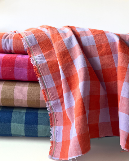 Yarn dyed gingham check cotton fabric collection in four colourways — blush and brown, bold red and pink, cool blue and teal, and statement orange and lavender — 100% cotton 3cm check, 145cm wide, ideal for handmade women's dresses, blouses and summer makes