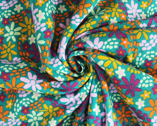Colourful Flowers French Terry Sweatshirting. Retro stretch print, sold in half meters. Great for sweaters and sweat dresses!