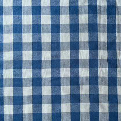 Cool blue and teal gingham woven cotton fabric folded to show yarn dyed check construction — modern 3cm gingham in a fresh palette, ideal for handmade women's blouses and relaxed summer dresses