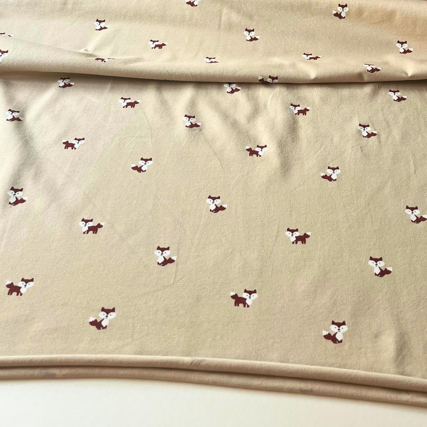 High-quality cotton jersey fabric with charming fox print, 150cm wide for dressmaking.