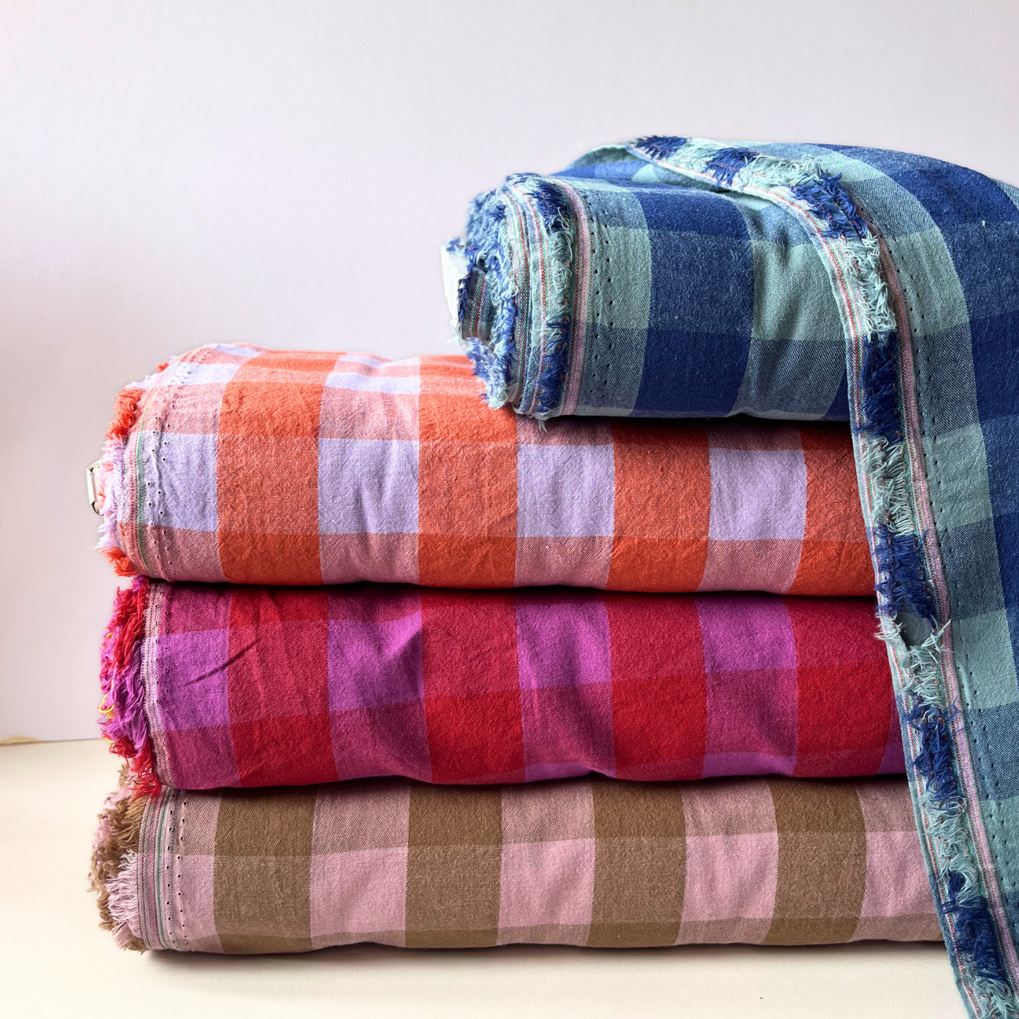 Modern dopamine coloured gingham woven cotton fabric folded to show yarn dyed check construction — classic 3cm gingham in a bold modern palette, perfect for statement handmade makes