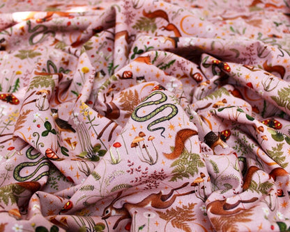 Pink autumn printed animal woodland cotton fabric. 100% cotton, sold in 1/2 meters.