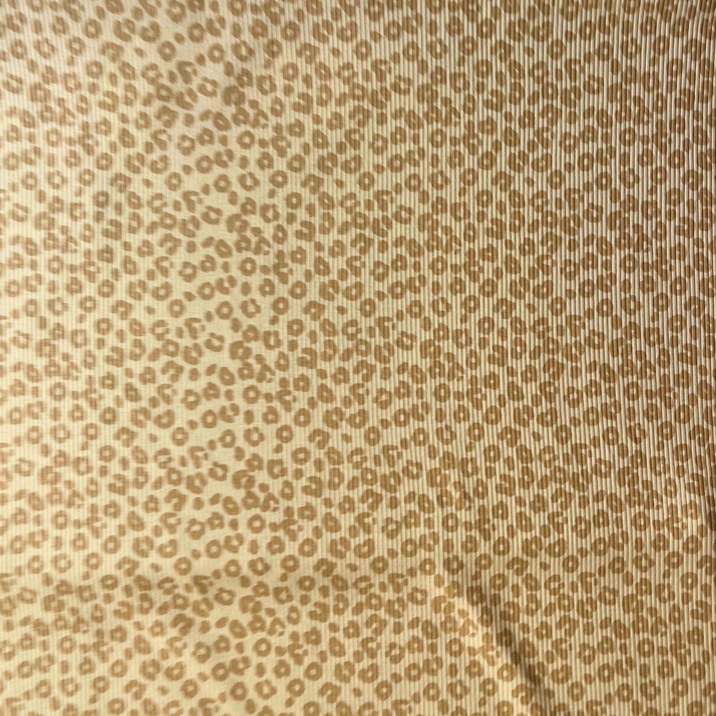 Soft and breathable rib knit fabric with subtle animal print, perfect for slow fashion sewing.