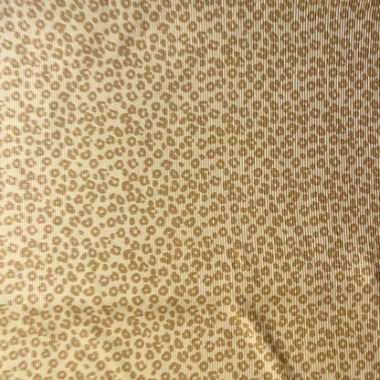 Soft and breathable rib knit fabric with subtle animal print, perfect for slow fashion sewing.