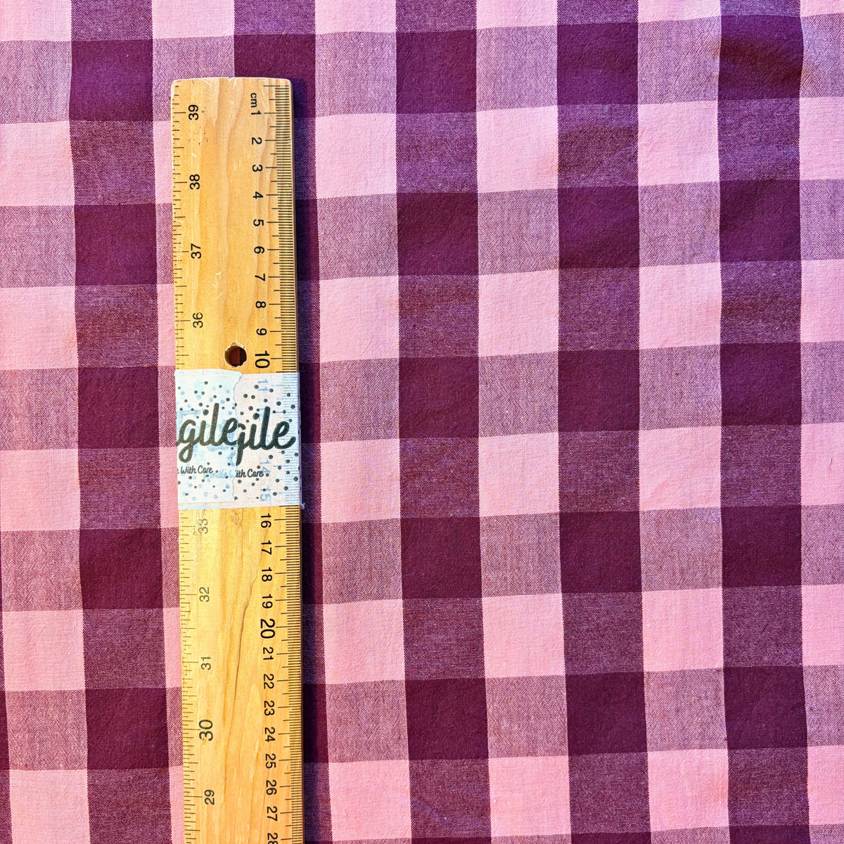 Aubergine pale pink gingham check cotton fabric flat lay showing 135gsm natural drape and generous 145cm width — yarn dyed 3cm woven check perfect for handmade dresses blouses and transitional autumn makes