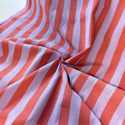 Burnt orange lavender 2.2cm yarn dyed stripe cotton fabric draped to show natural drape and 145cm width — coordinates with matching gingham for handmade children's pinafores summer dresses and blouses