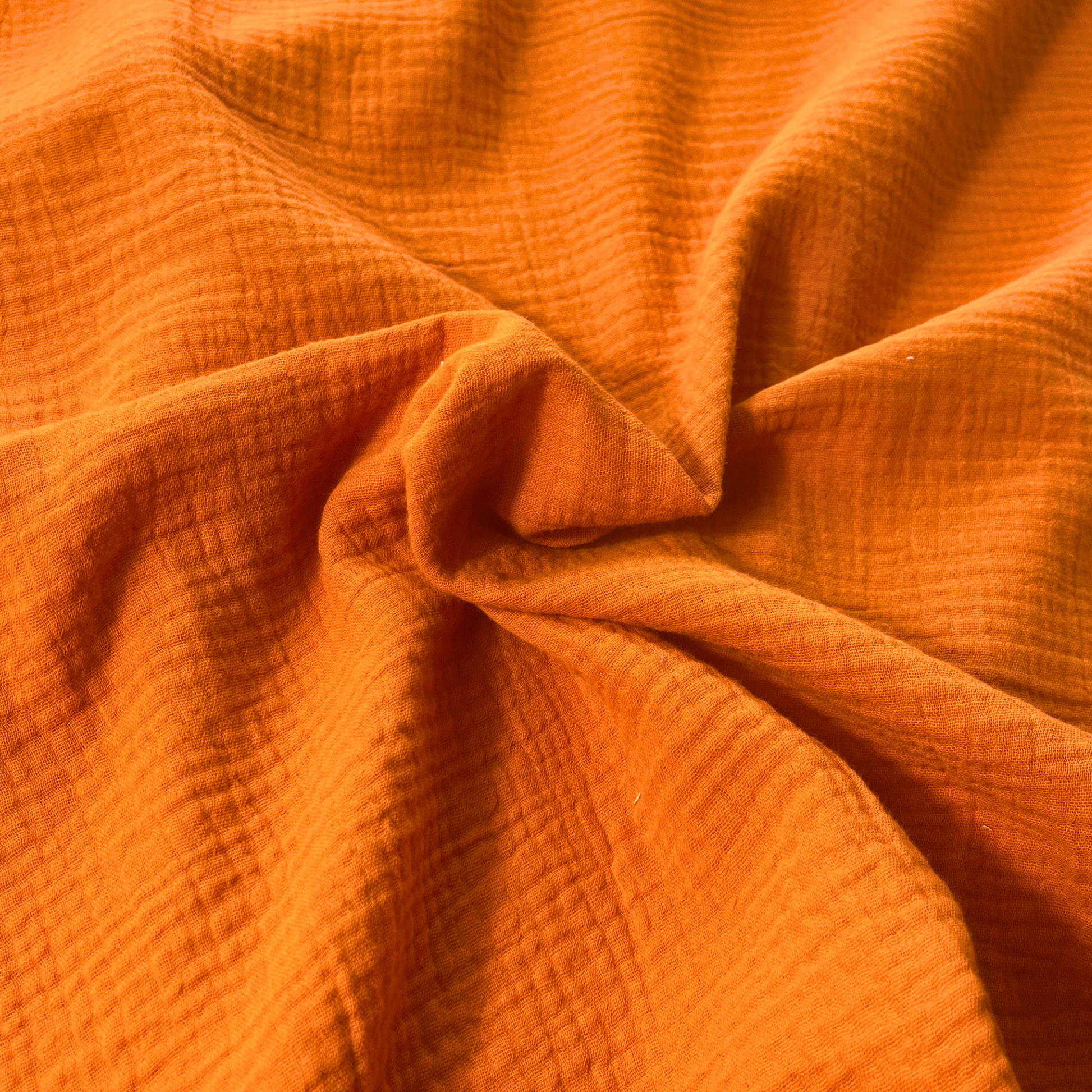 Burnt orange plain double gauze fabric, 135cm wide — featherlight 125gsm GOTS certified organic 100% cotton two-layer woven for handmade summer and autumn dresses, children's clothing and baby muslins