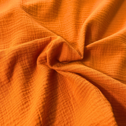 Burnt orange plain double gauze fabric, 135cm wide — featherlight 125gsm GOTS certified organic 100% cotton two-layer woven for handmade summer and autumn dresses, children's clothing and baby muslins