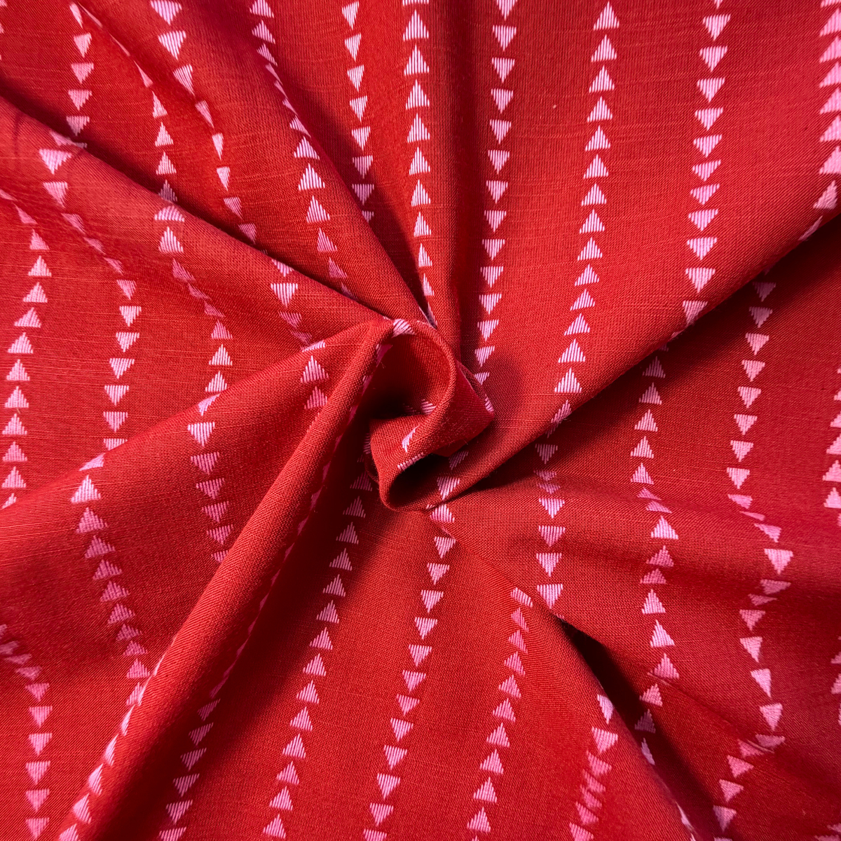 Burnt rich red and pink yarn dyed dobby triangle stripe woven cotton fabric — 135gsm 100% cotton reversible cut direction textured woven for slow fashion dressmaking blouses shirts and dresses