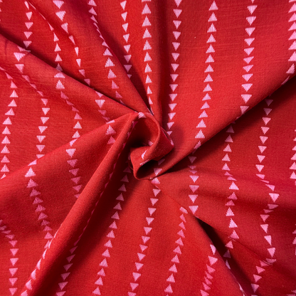 Burnt rich red and pink yarn dyed dobby triangle stripe woven cotton fabric — 135gsm 100% cotton reversible cut direction textured woven for slow fashion dressmaking blouses shirts and dresses