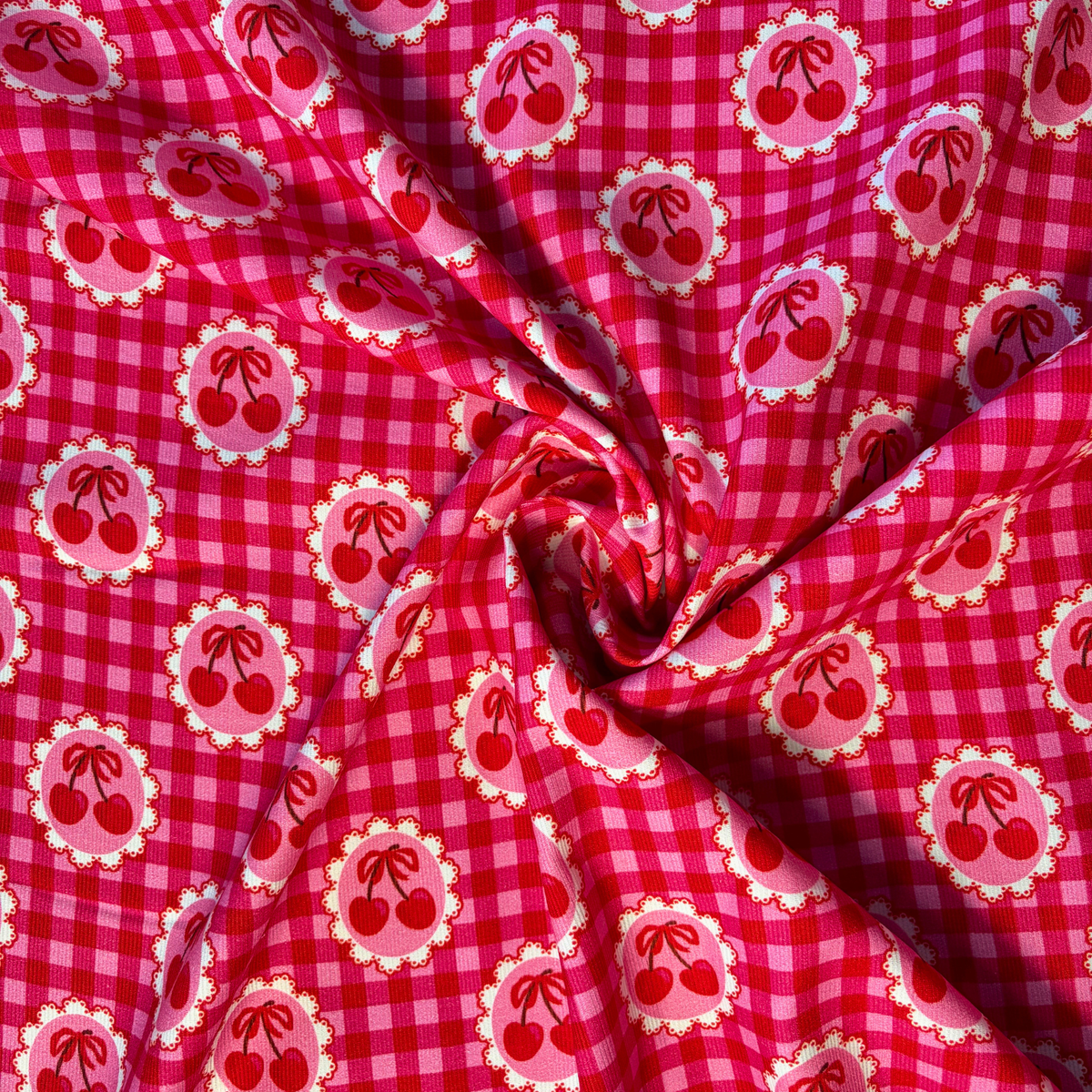 Cherry print needlecord fabric in red and pink gingham, 100% cotton corduroy 112cm wide 125gsm for slow fashion dressmaking pinafores dungarees and autumn winter sewing