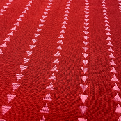 Close-up of indigo blue and lilac yarn dyed dobby triangle stripe woven cotton fabric showing raised vertical mini triangle texture — reversible cut direction 135gsm slow fashion dressmaking fabric UK