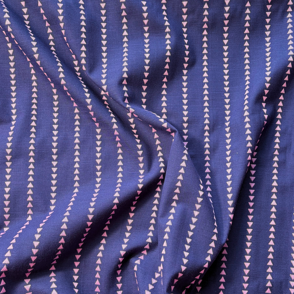 Indigo blue lilac dobby triangle stripe cotton fabric flat lay showing 135gsm natural drape and generous 145cm width — yarn dyed vertical mini triangle woven stripe perfect for handmade blouses dresses and wide-leg trousers