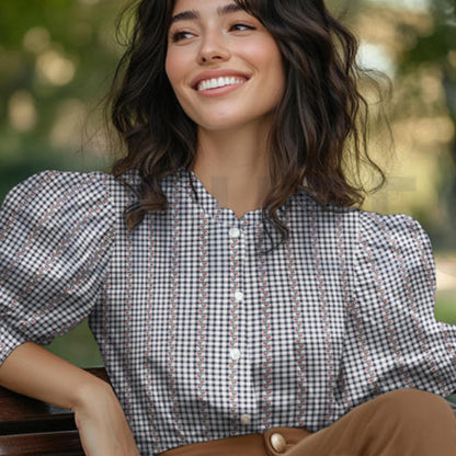 Cotton jacquard flowers fabric in navy, white and red folded to show raised woven floral texture on crisp mini gingham base — lightweight breathable woven ideal for handmade shirts, pinafores and summer dresses