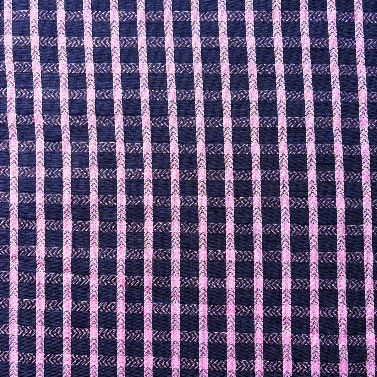 Navy pop pink dobby check cotton fabric flat lay showing 135gsm natural drape and generous 145cm width — raised woven grid check perfect for handmade dresses blouses and children's pinafores